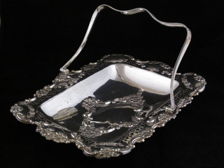 A rectangular embossed silver plated cake basket with swing handle
