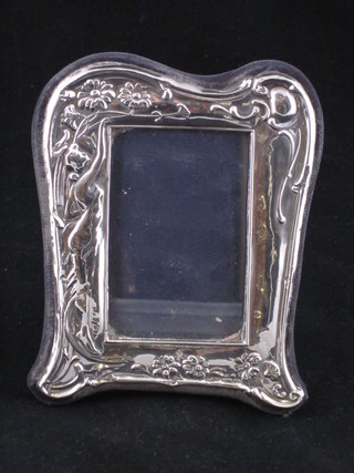 A modern Art Nouveau style easel photograph frame with  embossed floral decoration, 5"