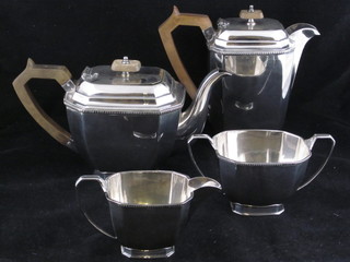 An Art Deco 4 piece silver plated tea service of rectangular form  comprising teapot, hotwater jug, twin handled sugar bowl and  cream jug