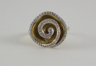 A lady's gold dress ring in the form of a flower head set  diamonds
