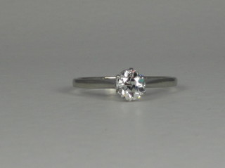 A lady's platinum solitaire engagement/dress ring set a diamond  ILLUSTRATED