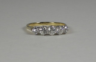 A lady's gold dress ring set 5 diamonds