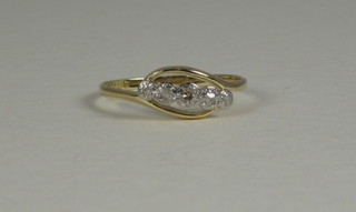 A lady's 18ct gold dress ring set 5 small diamonds