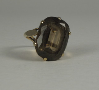 A lady's gold dress ring set an oval smoky quartz