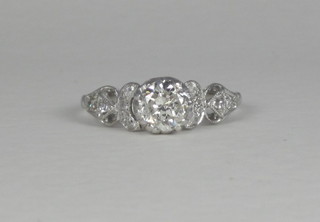 A platinum solitaire engagement/dress ring set a large diamond  and 9 diamonds to the shoulders ILLUSTRATED