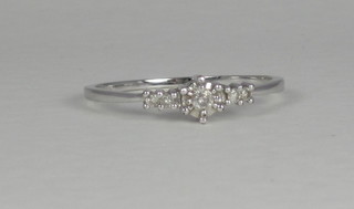 An 18ct white gold dress ring set diamonds