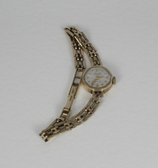 A lady's Avia wristwatch, contained in a gold case with integral  gold bracelet