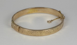 A lady's 9ct hollow gold bangle