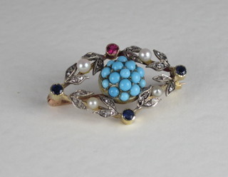 A gold brooch set turquoise and diamonds