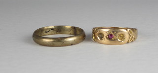 A 15ct gold dress ring set red stone, together with a gilt metal wedding band