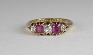 A 15ct gold dress ring set diamonds and red stones