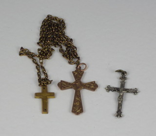 A 9ct gold cross, a gilt metal cross and a cross and chain