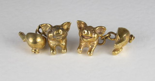 A pair of gilt metal cufflinks in the form of a pig