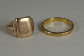 A gold wedding band and a gold signet ring