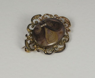 A 19th Century pinch beck mourning brooch with hair sculpture