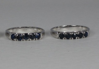 A white metal dress ring set blue stones and 1 other set 5 blue stones, 1 missing