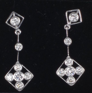 A pair of pierced diamond pendant drop earrings, approx 0.75ct