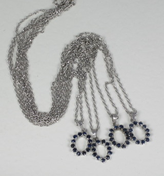 4 silver chains hung blue stone set pendants