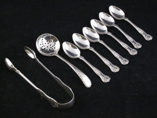 A pair of silver sugar tongs London 1916, a silver plated sifter spoon, 6 Queens pattern silver plated coffee spoons