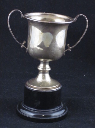 A silver twin handled trophy cup Birmingham 1948 2 ozs