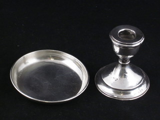 A circular silver dish, Birmingham 1938, 4" together with a  silver stub shaped candlestick