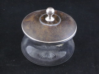 A circular cut glass dressing table jar with tortoiseshell and silver mounted lid, chip to lip, Birmingham 1916, 4"