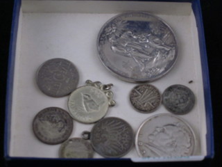 A religious silver medallion, a German silver coin and a small collection of silver coins