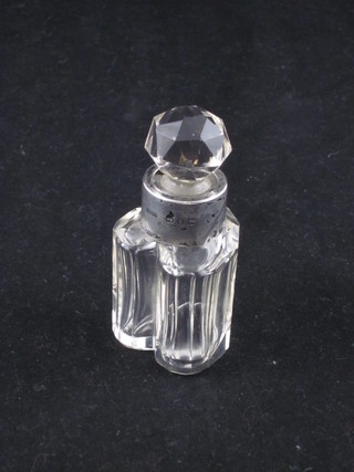A heart shaped glass scent bottle with silver collar 3"