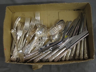 A collection of silver plated flatware, fish knives and forks etc