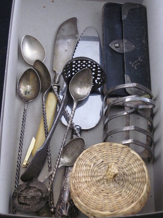 A George III silver fiddle pattern sifter spoon, London 1784, a leather and silver mounted purse etc