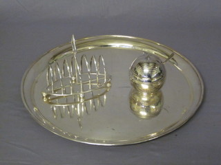A silver plated 7 bar toast rack, a large circular silver plated dish and a preserve jar and cover