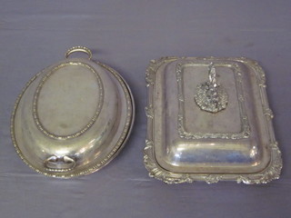 A rectangular silver plated entree dish and cover together with an oval ditto