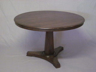 A circular Victorian breakfast table raised on a chamfered  column with triform base 40"