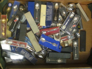 A collection of souvenir teaspoons
