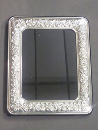 A modern embossed silver easel photograph frame 13" x 10"