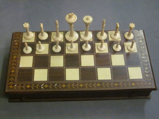 A 32 piece carved ivory chess set, complete, contained in an  inlaid box