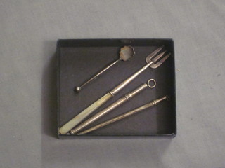 2 silver swizzle sticks, 1 f, a silver pickle fork with mother of pearl handle and a silver salt spoon