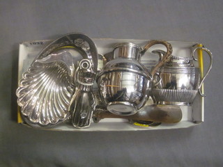 A silver plated Jersey milk jug, do. scallop shaped butter dish, small collection of plated items