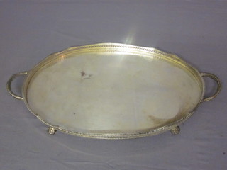 An oval silver plated galleried and twin handled tea tray 18"