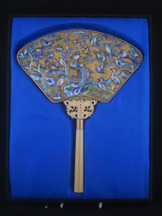 An Eastern gilt metal handmirror with enamelled decoration