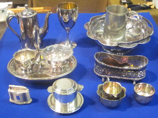 A silver plated coffee pot, an oval shaped dish and a small  collection of plated items