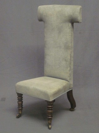 A William IV rosewood Prie Dieu chair upholstered in green material