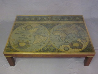 A rectangular mahogany coffee table the top inset a map of the world within a brass banded frame 52"