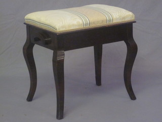 A mahogany box seat piano stool, raised on cabriole supports 20"