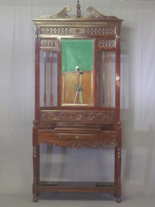 An Edwardian style mahogany hall stand with bevelled plate  mirror to the centre, the base fitted a drawer, compete with drip  tray, 37"