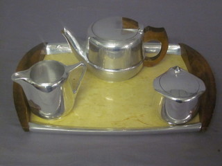 A Picquot ware 3 piece metal tea service comprising teapot,  milk jug and sugar bowl, complete with matching twin handled  tray