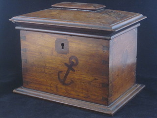 A 19th Century box of sarcophagus form with hinged lid inlaid  hour glasses, dove and a cross, the body of the box inlaid  symbols of faith, hope and charity 10", slight chip to top left  hand side of lid,