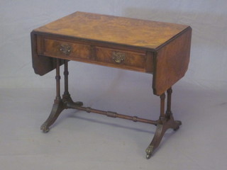 A reproduction Georgian style figured walnut miniature sofa  table, fitted 2 drawers and raised on turned supports 24"