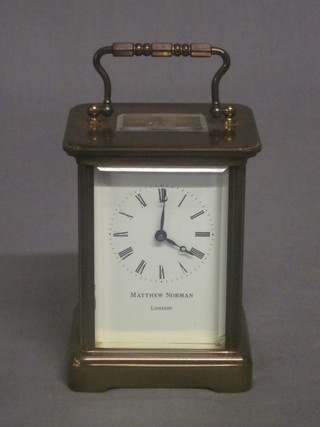 A 20th Century carriage clock with enamelled dial and Roman  numerals by Matthew Norman of London, chip to glass, 3"   ILLUSTRATED