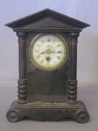 An American shelf clock with metal dial and Roman numerals contained in a Portico shaped case 10"
